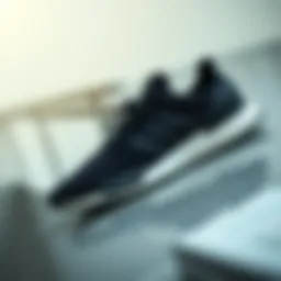 Stylish black Adidas shoes on a sleek surface