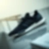 The Elegance of Black Adidas Footwear Stylish black Adidas shoes on a sleek surface