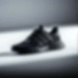 Elegant black Adidas sports shoes on a minimalist background