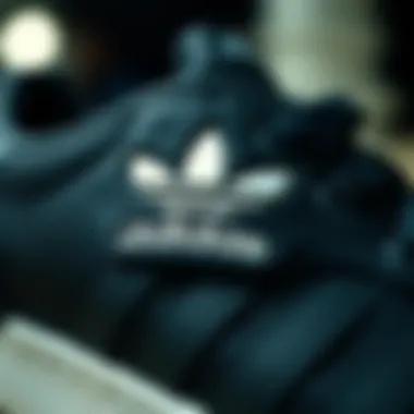 Detailing the Iconic Adidas Logo Close-up of Adidas logo on black sports footwear