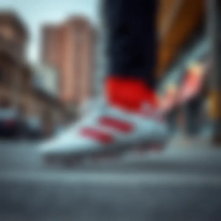 Stylish presentation of adidas Predator Freak Elit FG against a contemporary urban backdrop