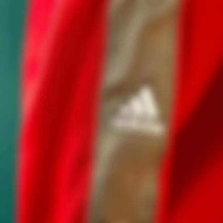 Close-up of the high-quality fabric used in the Adidas red tracksuit