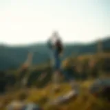 A serene landscape showing a person practicing yoga outdoors