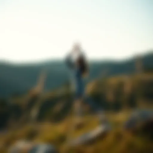 A serene landscape showing a person practicing yoga outdoors