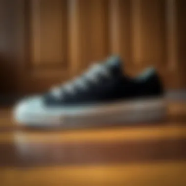 Iconic Design of Converse Chuck 70 Plus Stylish black and white Converse Chuck 70 Plus sneakers on a wooden floor