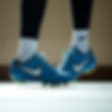 Stylish look of Nike blue cleats in a sporty setting