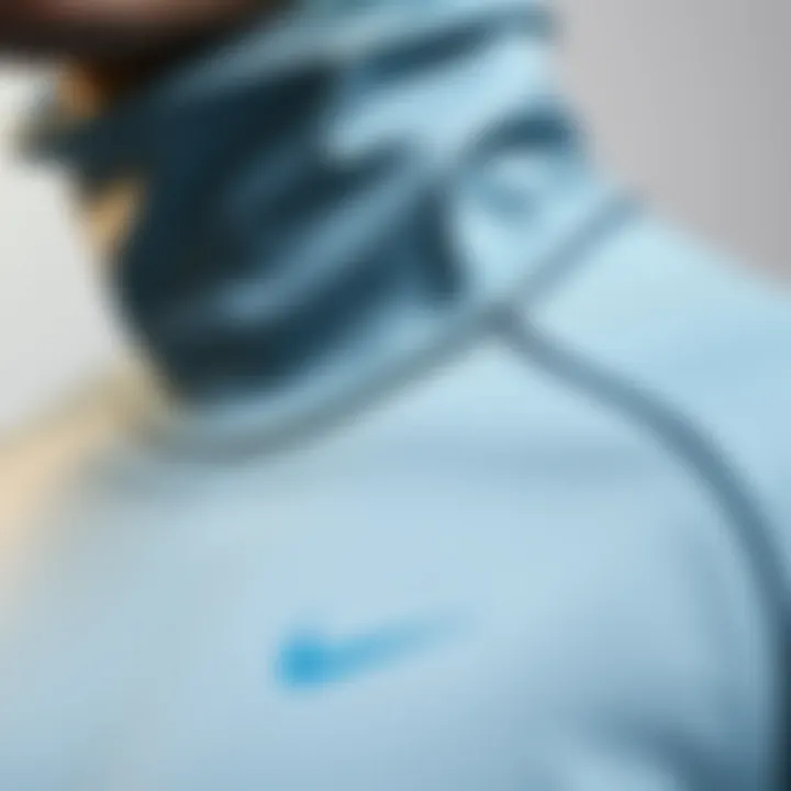 Fabric Details of Nike High Neck Clothing Close-up of fabric details on Nike high-neck clothing emphasizing comfort and design.