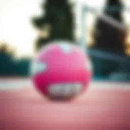 A vibrant pink volleyball highlighting its unique design features