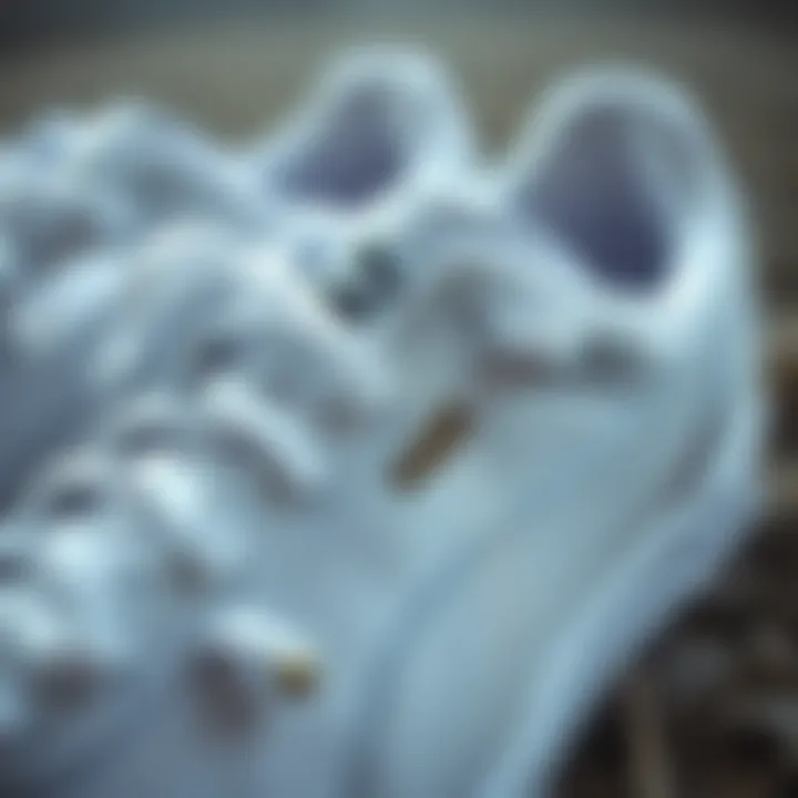 Close-up of Puma white sneakers showcasing design details