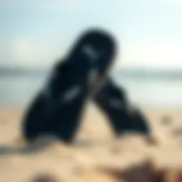 Stylish Puma flip-flops on a beach